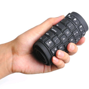 Bluetooth folding silicone keyboard held in a hand, showcasing its portable and flexible design.