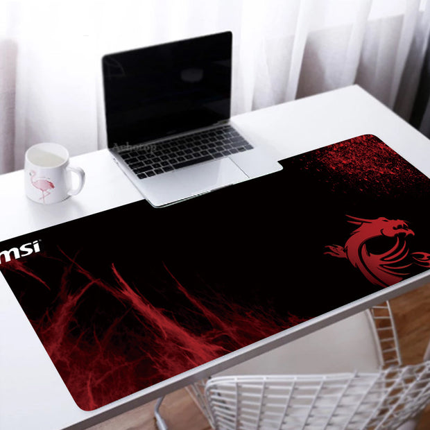 Custom Large Gaming Mouse Pad on a desk with a laptop and coffee mug.