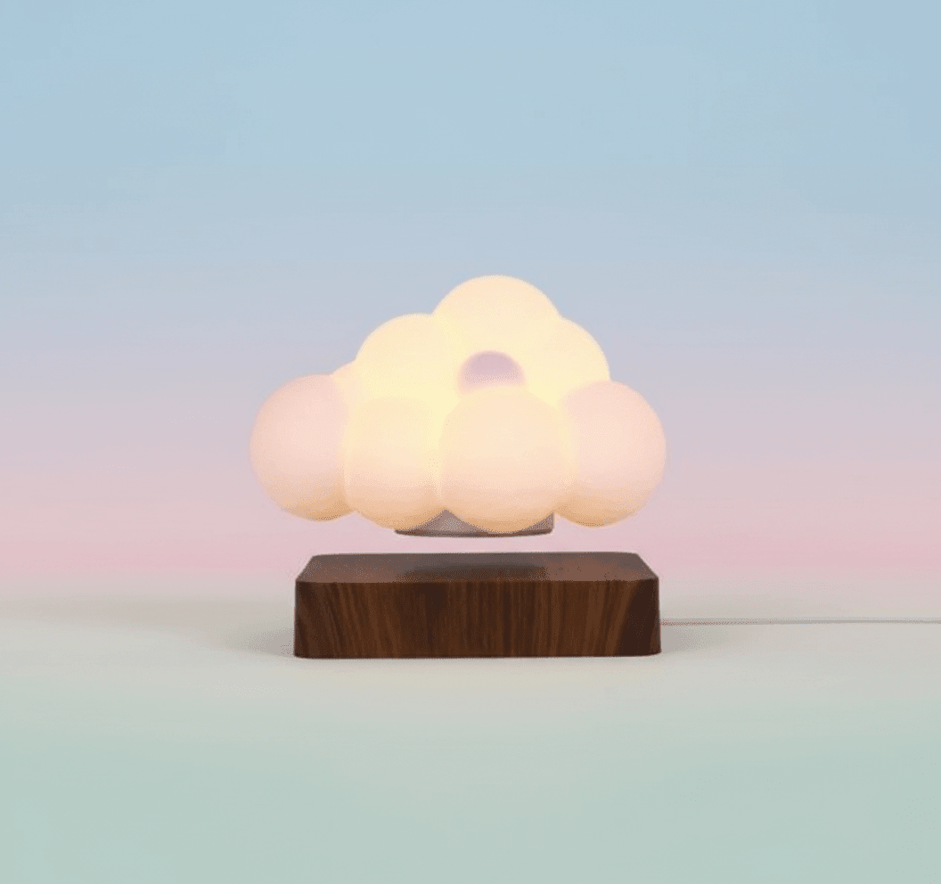 Glowing Cloud Light on a wooden base with a soft, dreamy glow against a pastel background.