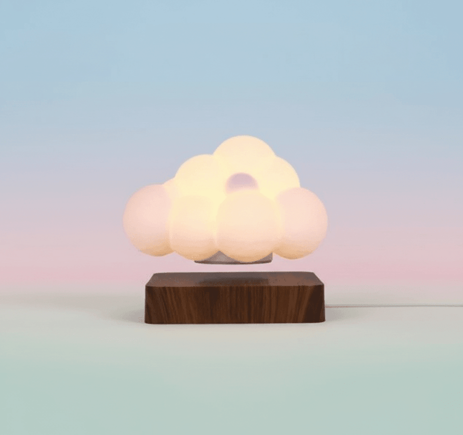 Glowing Cloud Light on a wooden base with a soft, dreamy glow against a pastel background.
