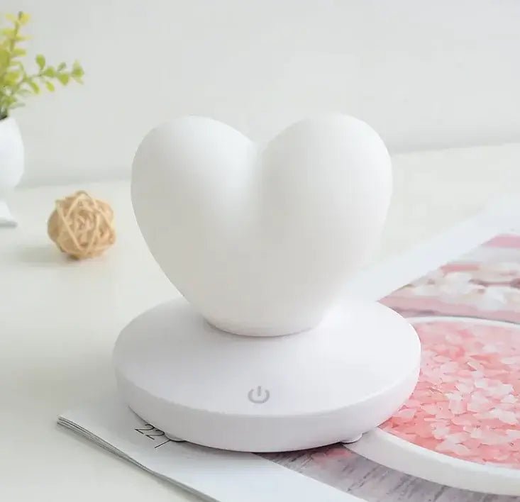 GlowTouch Desk Lamp in heart shape design, providing soft illumination and modern style for any space.