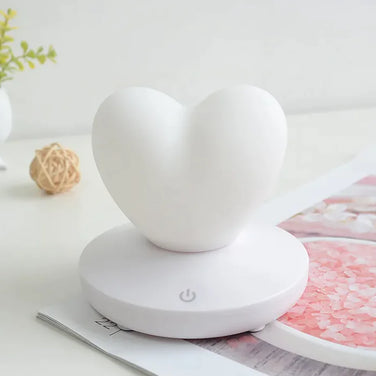 GlowTouch Desk Lamp in heart shape design, providing soft illumination and modern style for any space.
