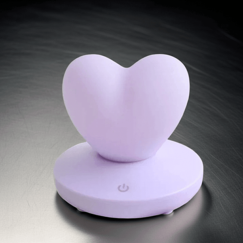 GlowTouch Desk Lamp in a heart shape, providing soft illumination for your workspace.