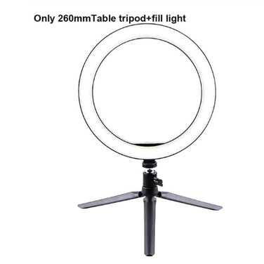 LED Ring Light on a table tripod, providing soft illumination for photography and video calls.
