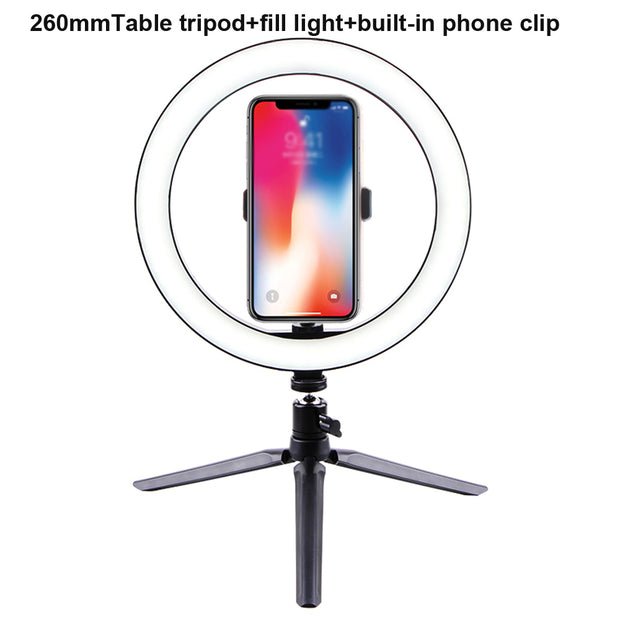 LED Ring Light with phone clip on tripod for enhanced lighting during video calls and photography.