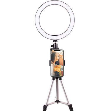 LED Ring Light on a tripod with a smartphone holder for improved video quality and lighting.