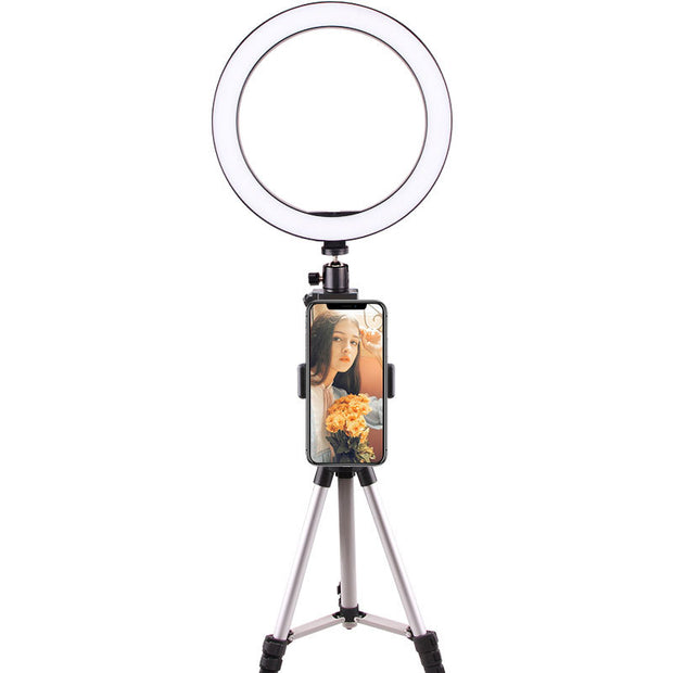 LED Ring Light on a tripod with a smartphone holder for improved video quality and lighting.