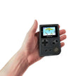 MINI Handheld Game Console with Built-in Nostalgic Games in a hand displaying a classic game on the screen.