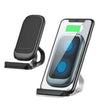 Mobile phone wireless charger with sleek design and LED indicator, charging phone on modern stand.