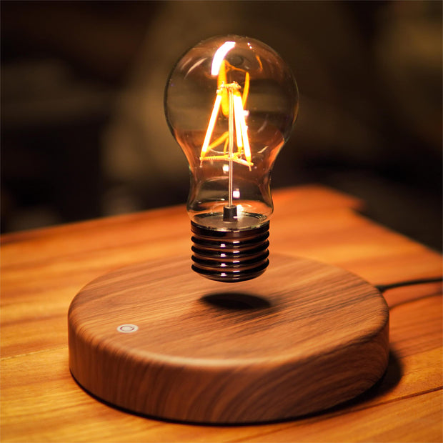 Mystical Floating Desk Lamp featuring a levitating LED bulb on a wooden base, ideal for modern decor.