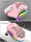 Rechargeable Wireless RGB Gaming Mouse with honeycomb design and RGB lighting on a laptop