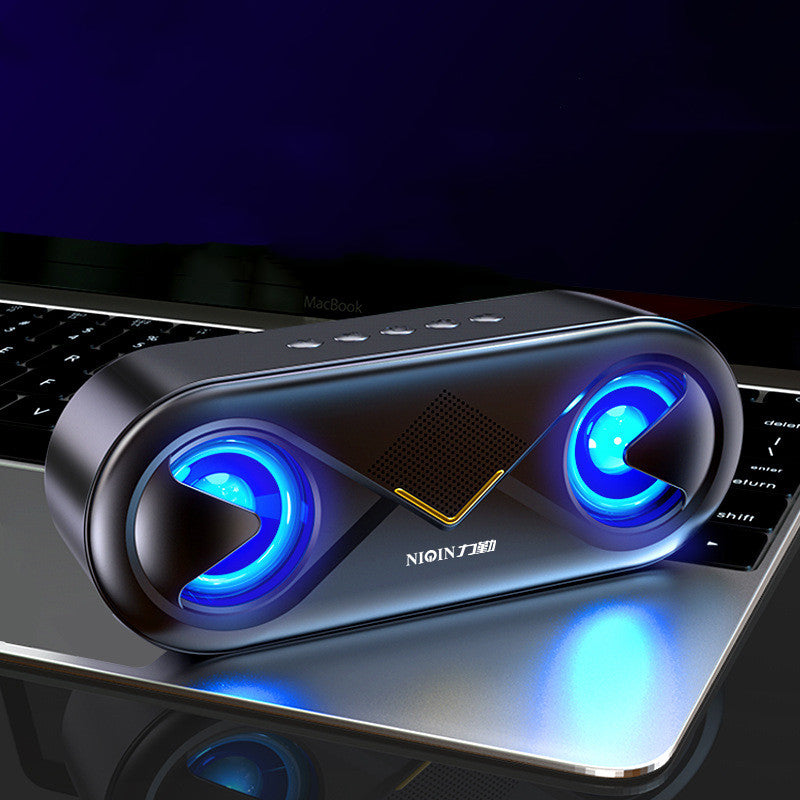 Sonic Boom Bluetooth Speaker on a laptop keyboard with blue LED lights.