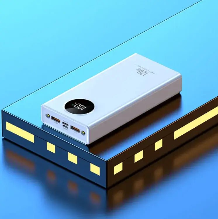 Super Fast Charge Power Bank on a blue surface, showcasing its compact design and dual charging ports.