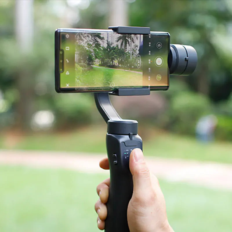 Ultimate Phone Steady Tripod in use, capturing smooth video footage outdoors with a smartphone on a gimbal.