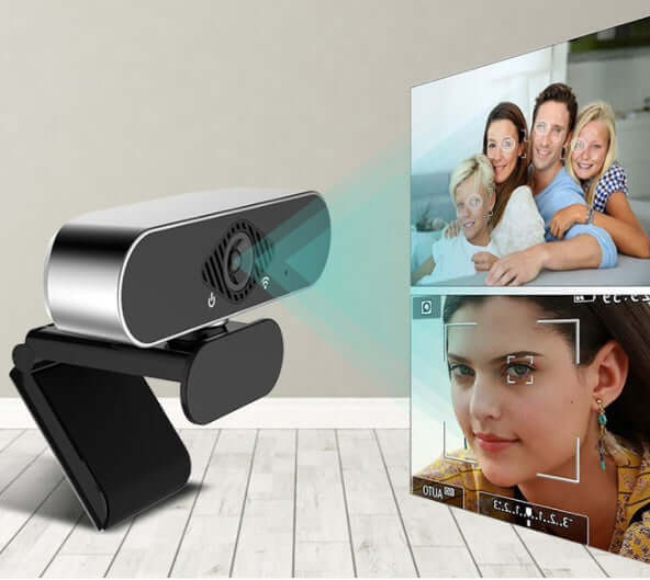 Webcam with microphone streaming clear visuals during a video call on a monitor.