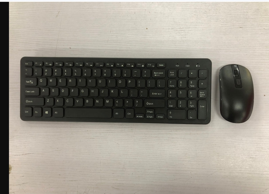 Wireless Keyboard and Mouse Set positioned on a clean surface, showcasing the sleek black design.